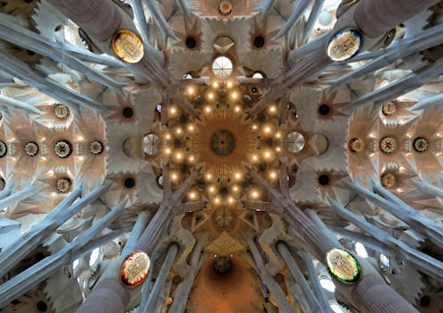 Intricate ceiling detail of the Sagrada Familia Basilica in Barcelona, showcasing Art Nouveau design.